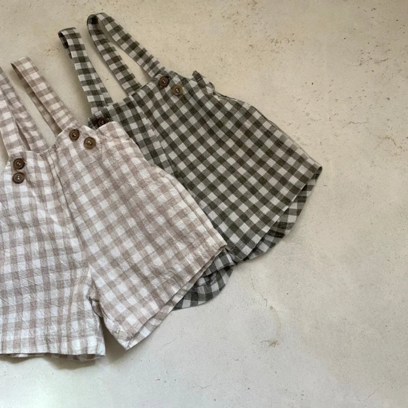 Jardineira Baby Xadrez – Boutique Infantil Les Enfants
